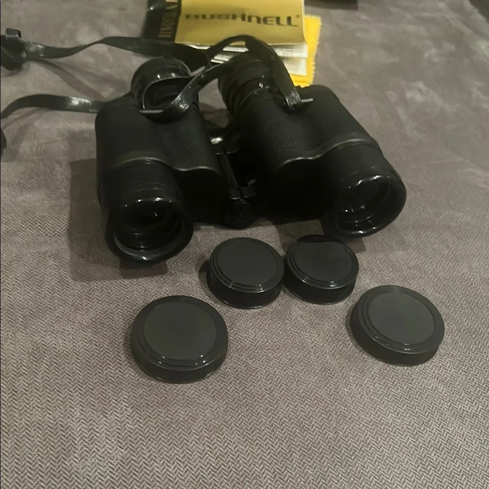 Black Bushnell Binoculars with Rubber Armor and Central Focus